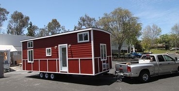 RED BARN CARAVAN 10 X 30 TINY HOUSE FULLY FINISHED PROFESSIONALLY BUILT - Image 1 Thumbnail