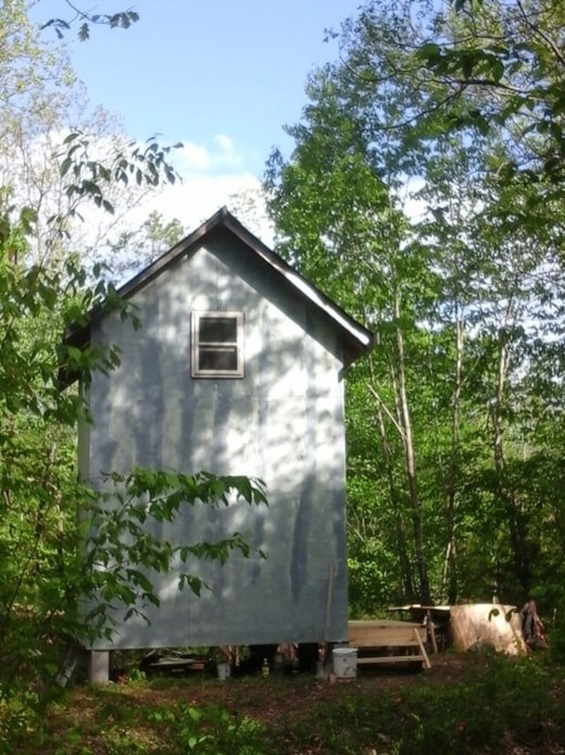 Tiny house shell on creek on 28 acres near Hot Springs, Arkansas