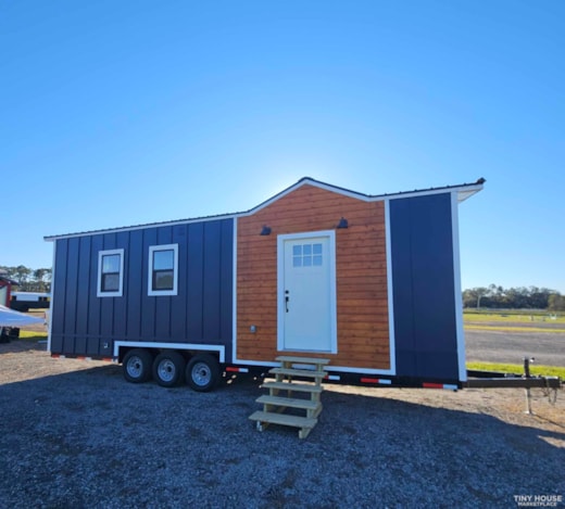 Downstairs Bedroom, full size kitchen and bathroom tiny home on wheels