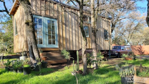 Rustic self-sufficient 31' handmade redwood tiny house