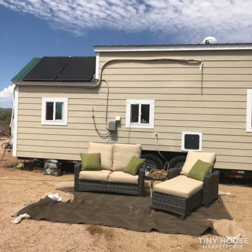 Solar Tiny house with downstairs. Bedroom and 2 lofts