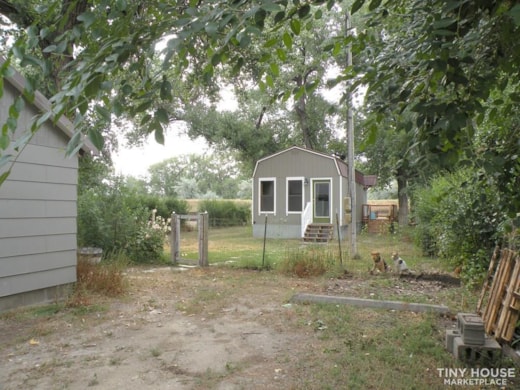 Tiny home on permanent foundation, detached garage